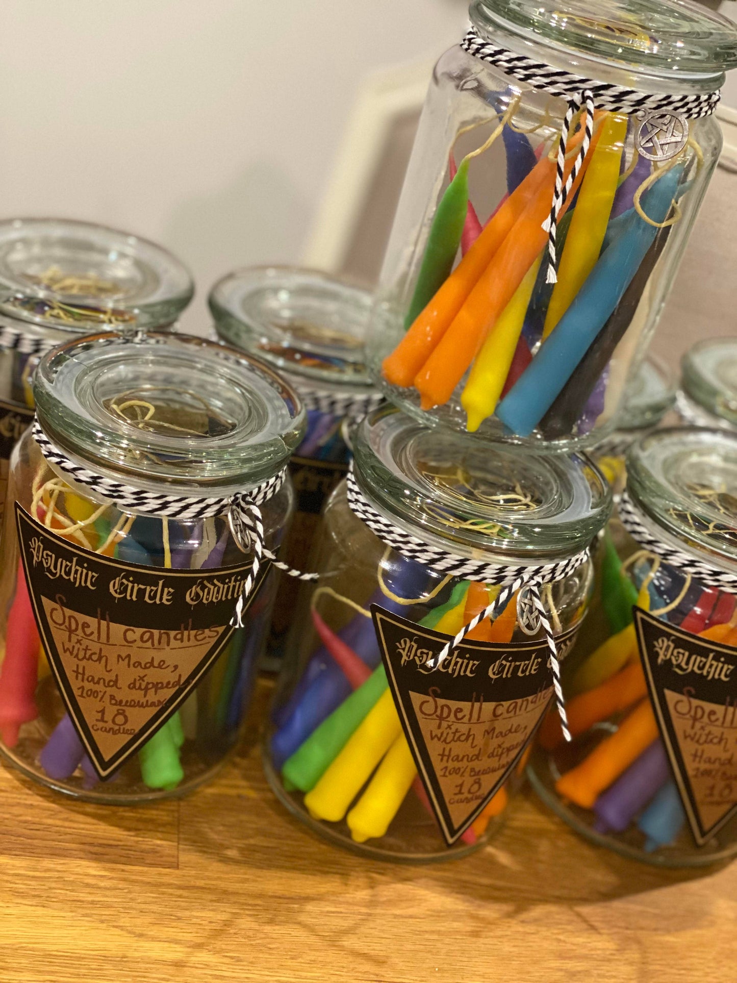 Large reusable jar filled with 18 beeswax chime candles. Assorted colors. Handmade in Los Angeles, CA